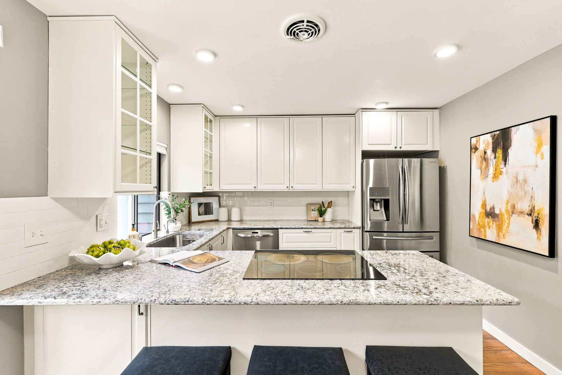 Kitchen with quartz countertops and stainless steel appliances