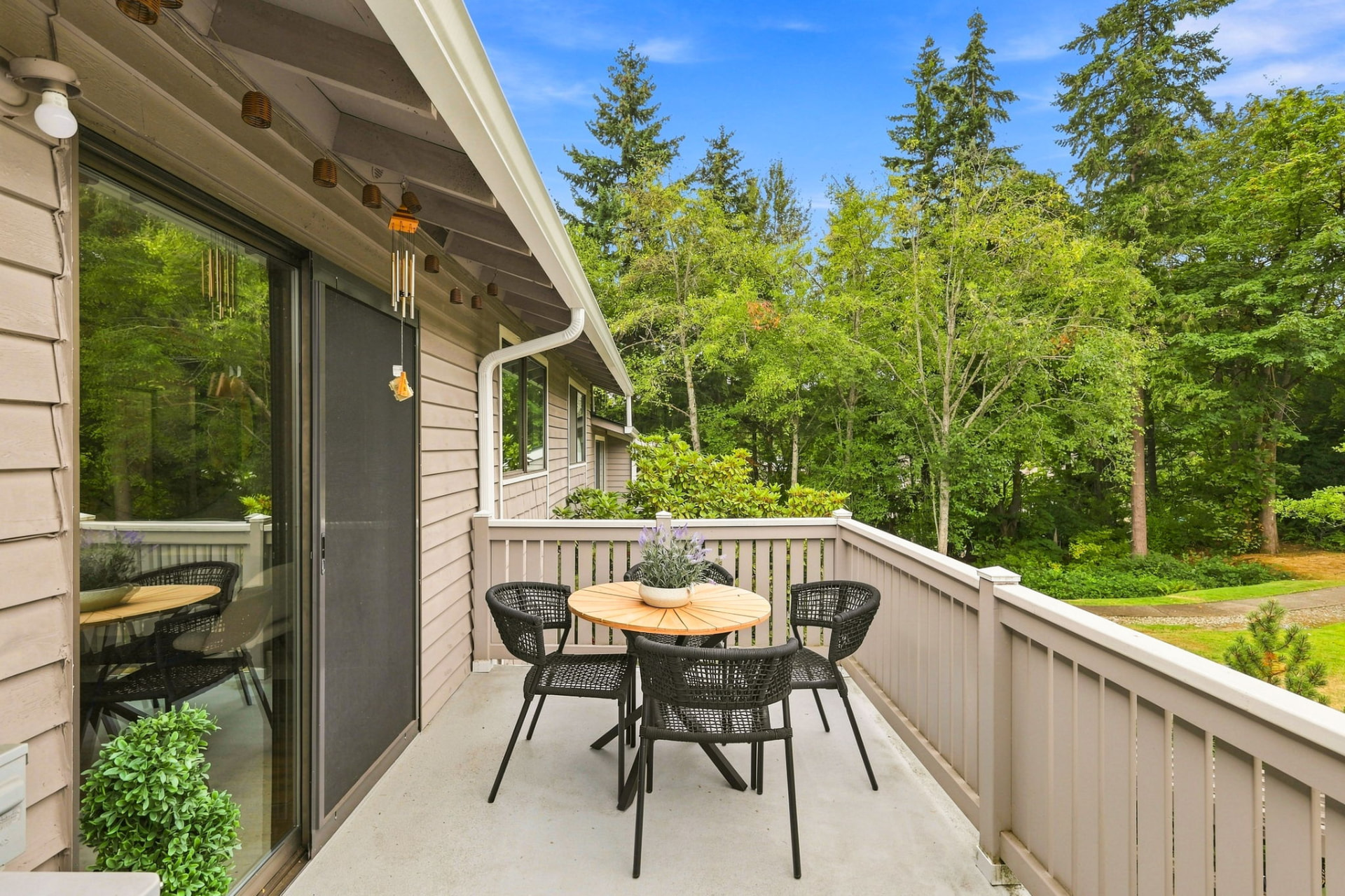 Private balcony overlooking trees and shared green space